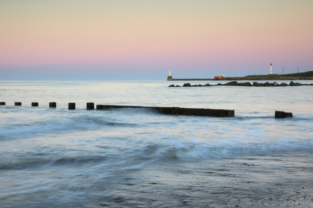 Aberdeen beach with South Breakwater Lighthouse in the distance