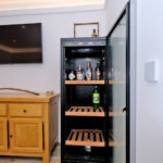 No need to miss the game from Smart TV - Refreshments keep cool and to hand with drinks fridge in dining area
