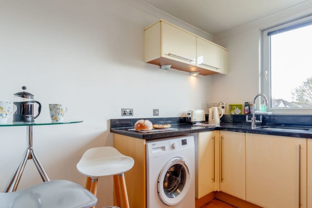 Bright kitchen with granite worktops